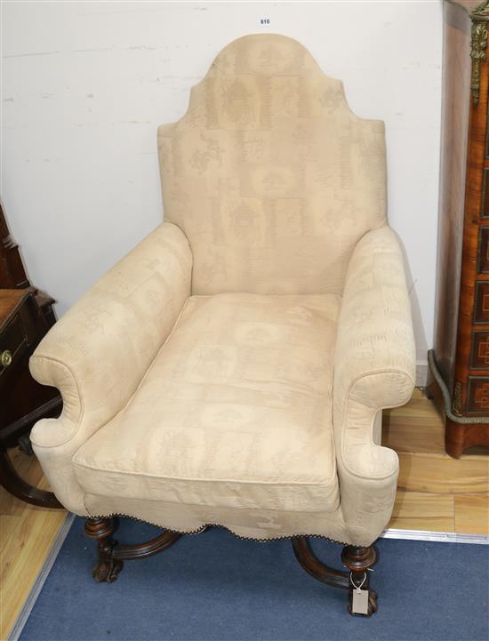 A William and Mary style walnut framed camel back armchair